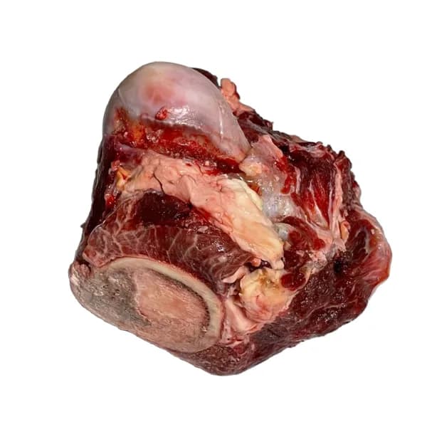 Raw beef knuckle cut on white background
